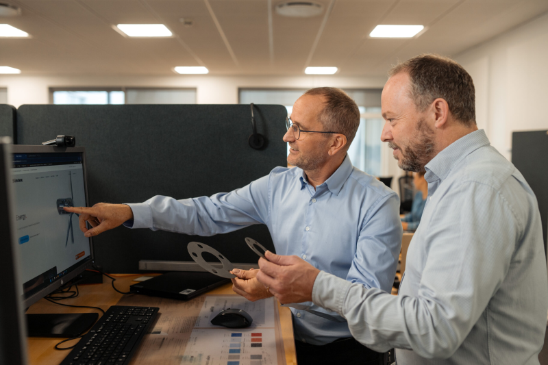 Sintex employees at computer